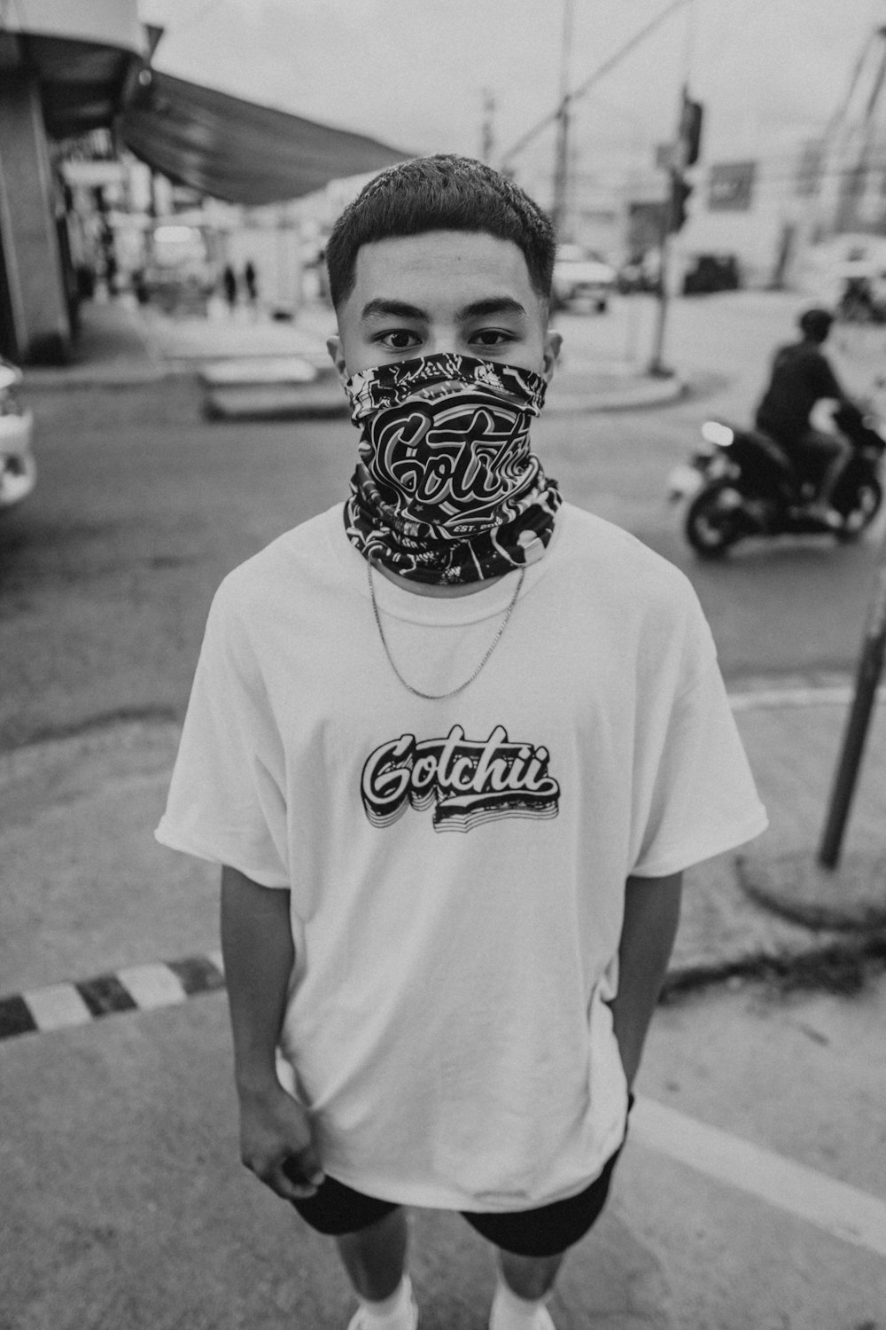 man in white crew neck t-shirt wearing black mask