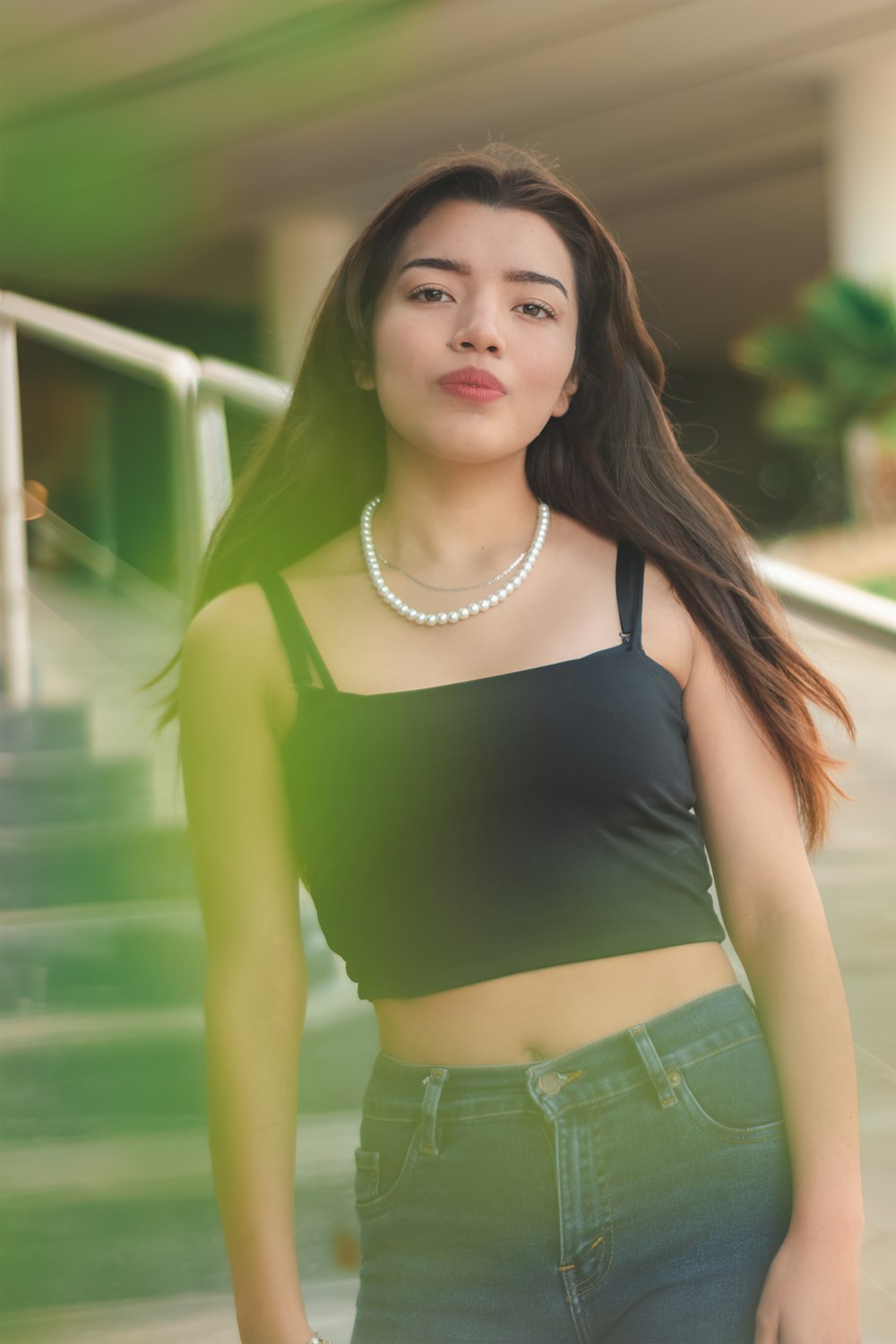 woman in black tank top and blue denim shorts