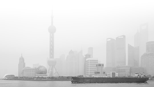 grayscale photo of city skyline during daytime in Pudong Skyline China