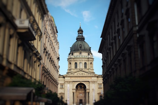white concrete building under blue sky during daytime in St. Stephen's Basilica Hungary