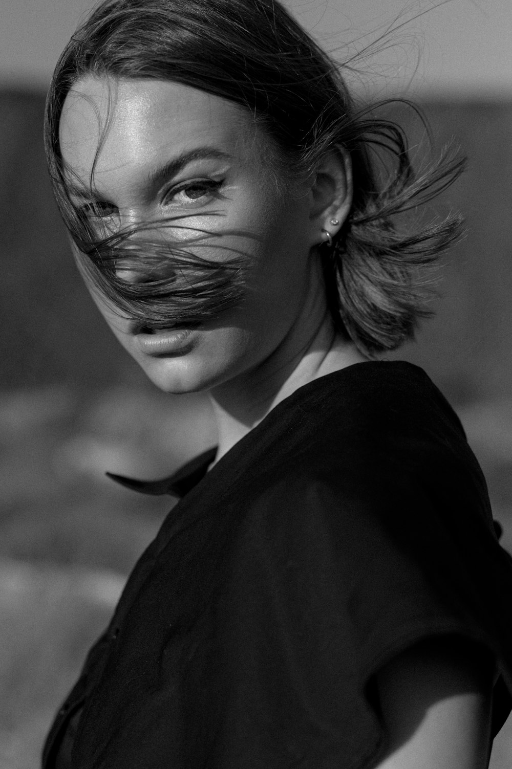 woman in black shirt in grayscale photography