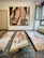 Vibrant abstract painting hanging on a white gallery wall with soft natural light.