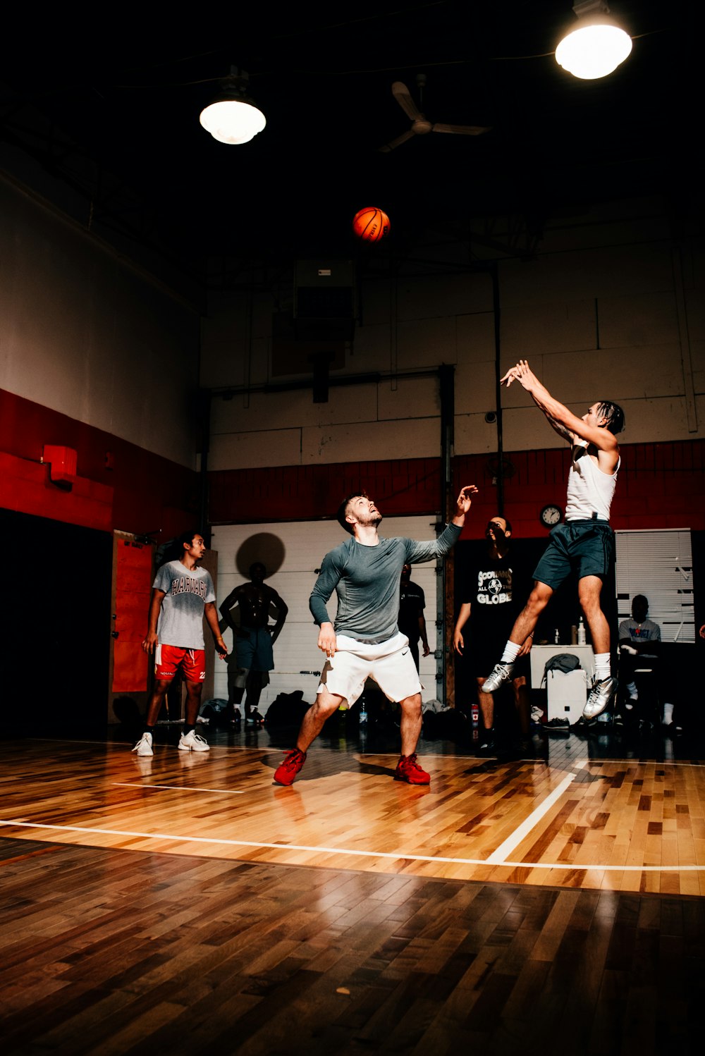 group of men playing basketball