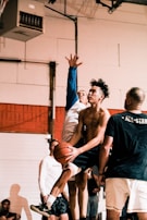An action shot of students competing in a basketball game.
