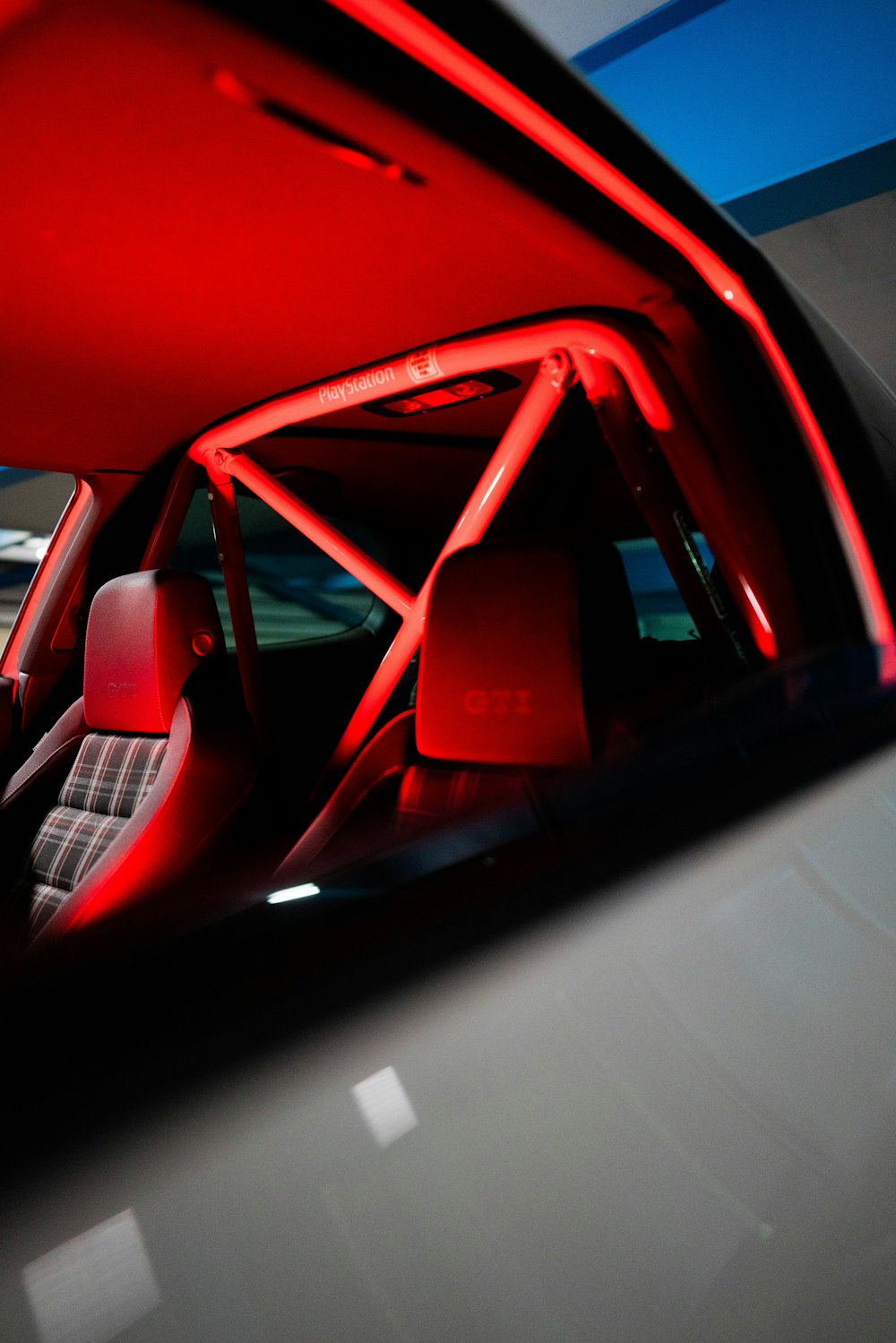 red car with white and black car door