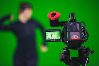 man in black shirt standing near black video camera