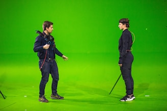 man in black jacket and black pants holding microphone