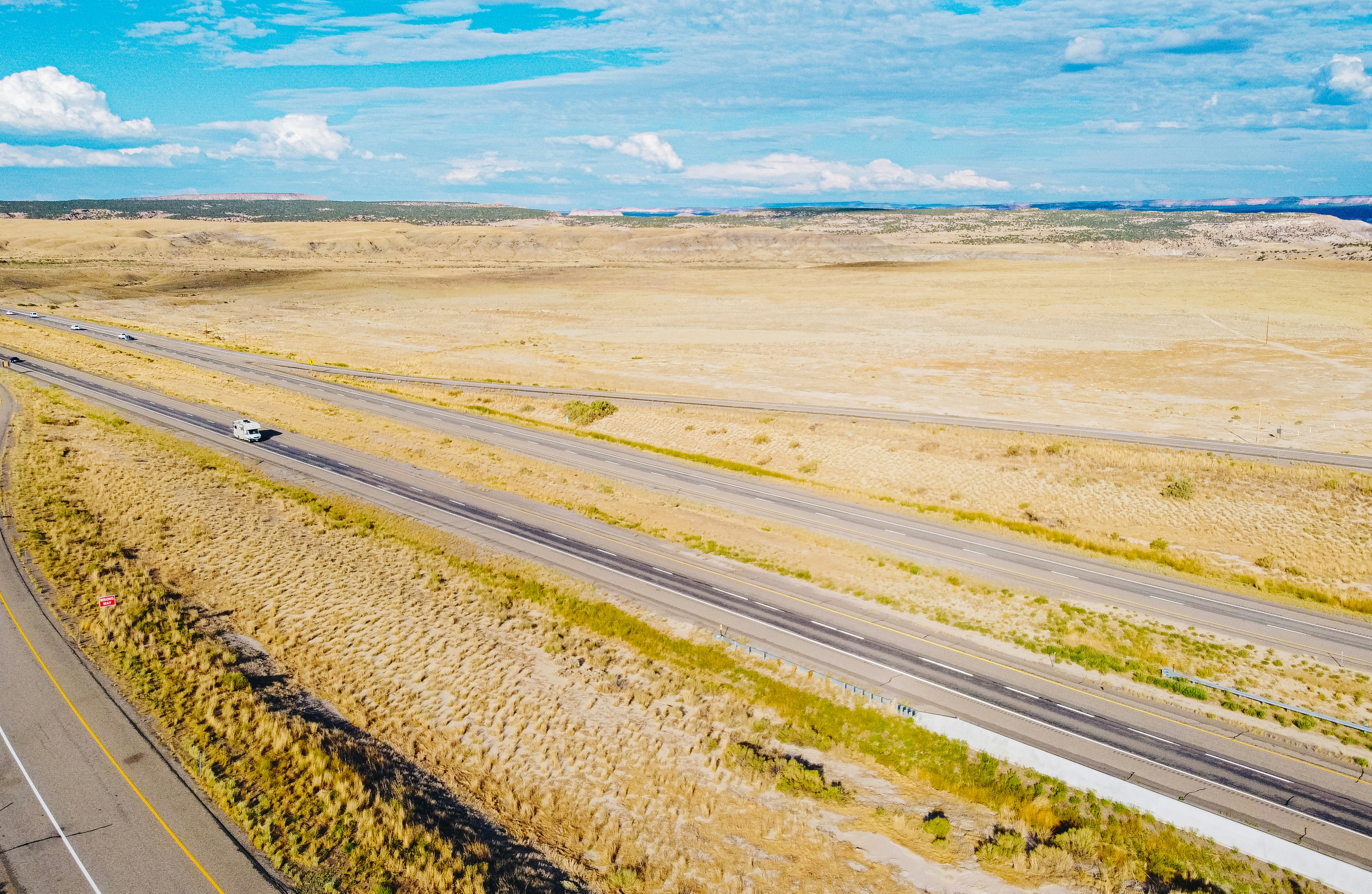 brown sand near body of water during daytime