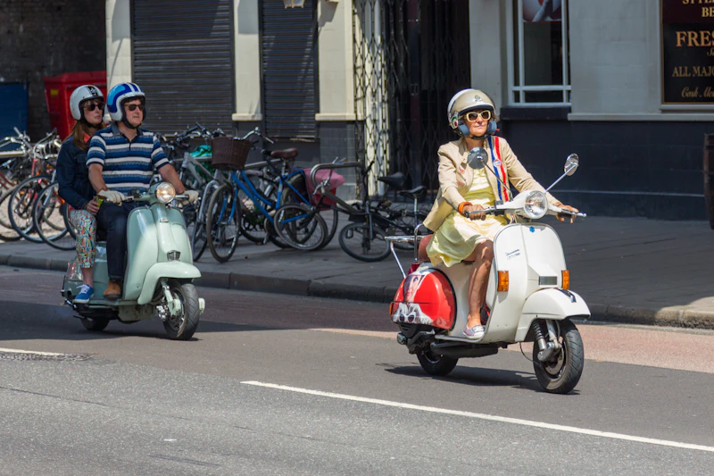 Rider on a red and white scooter