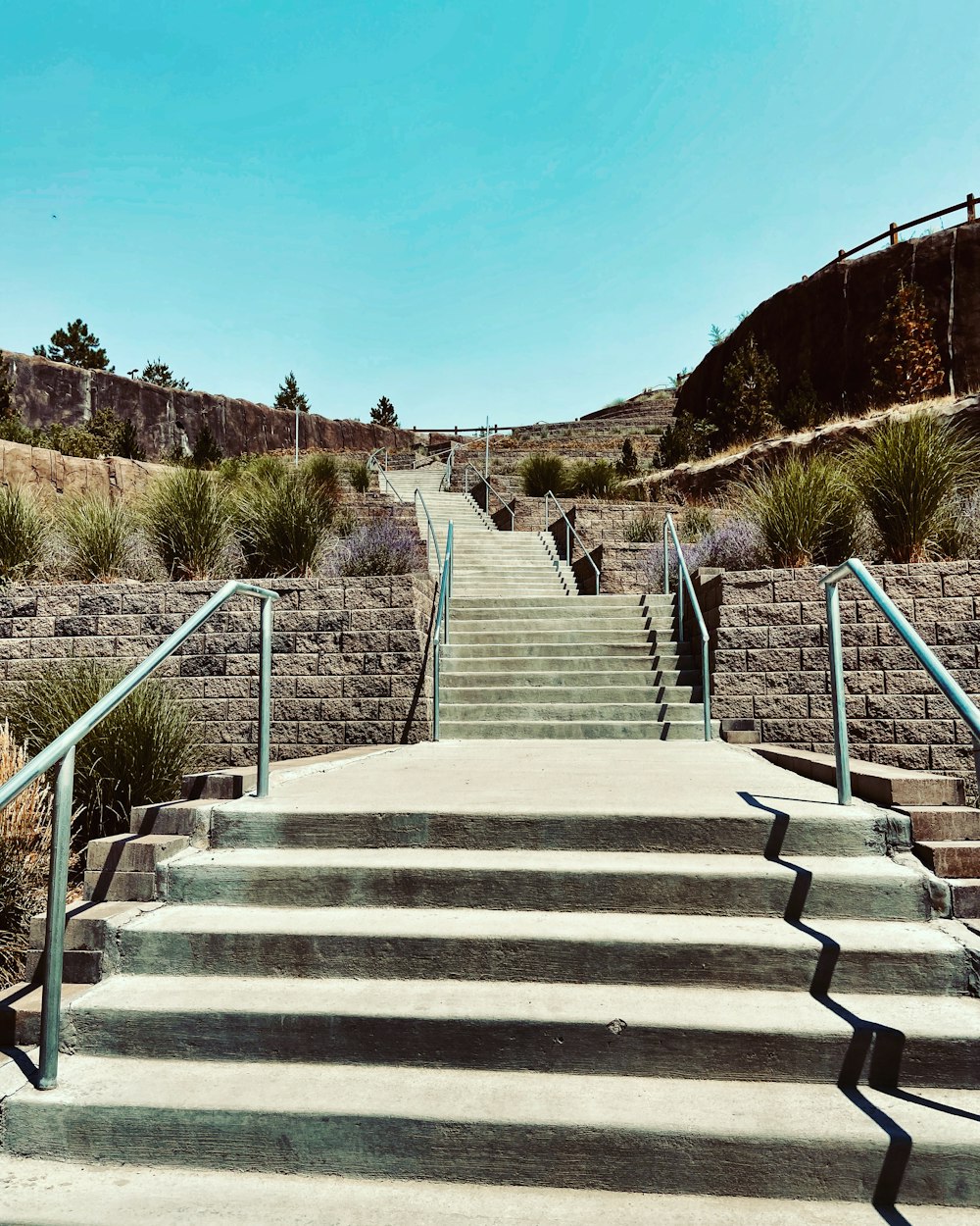 gray concrete stairs on mountain during daytime