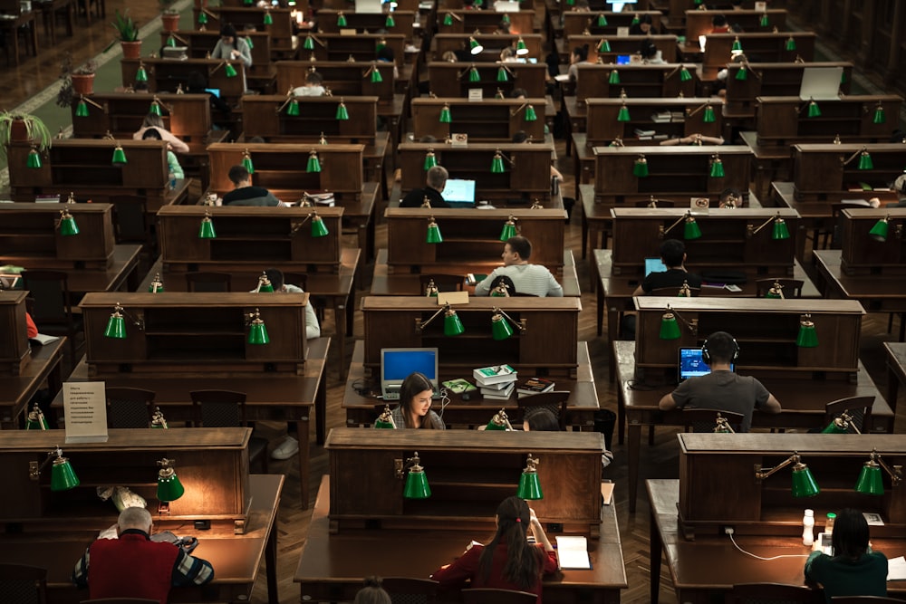 a room filled with lots of desks covered in computers