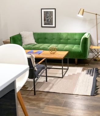 green sofa beside white table