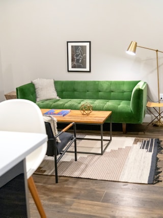 green sofa beside white table