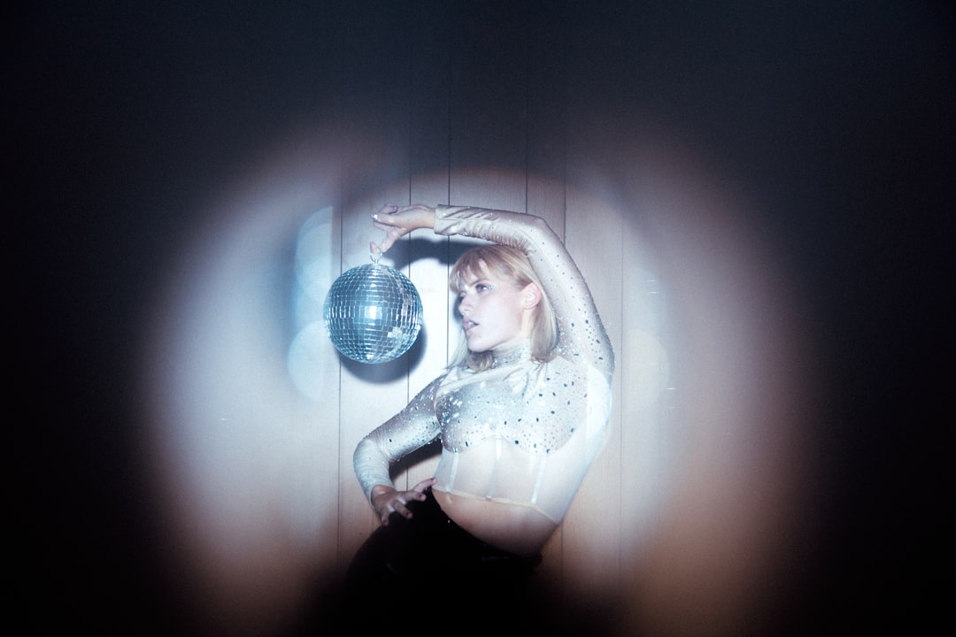 woman in white and black polka dot shirt