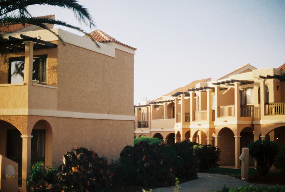 beige concrete building near green trees during daytime