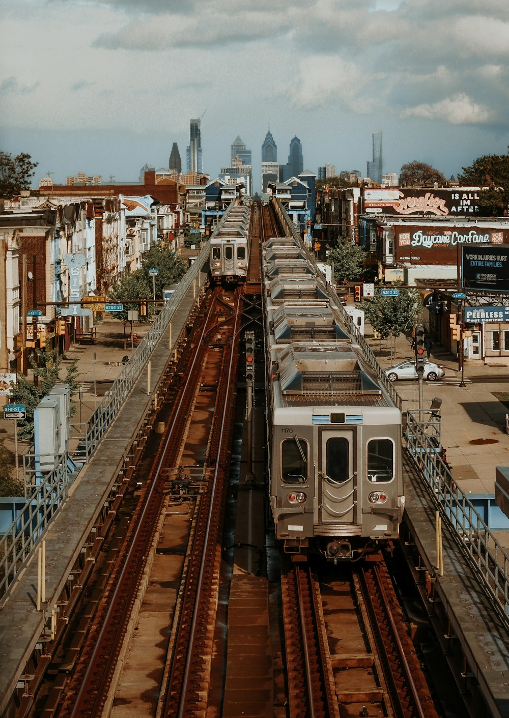 white train on rail road during daytime