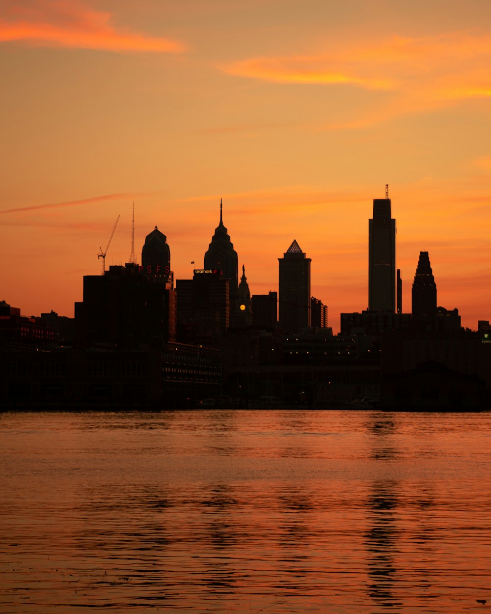 silhouette of city buildings during sunset