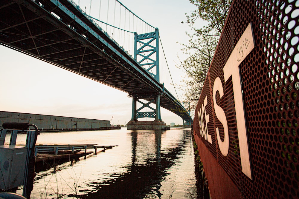 brown and white bridge over river during daytime