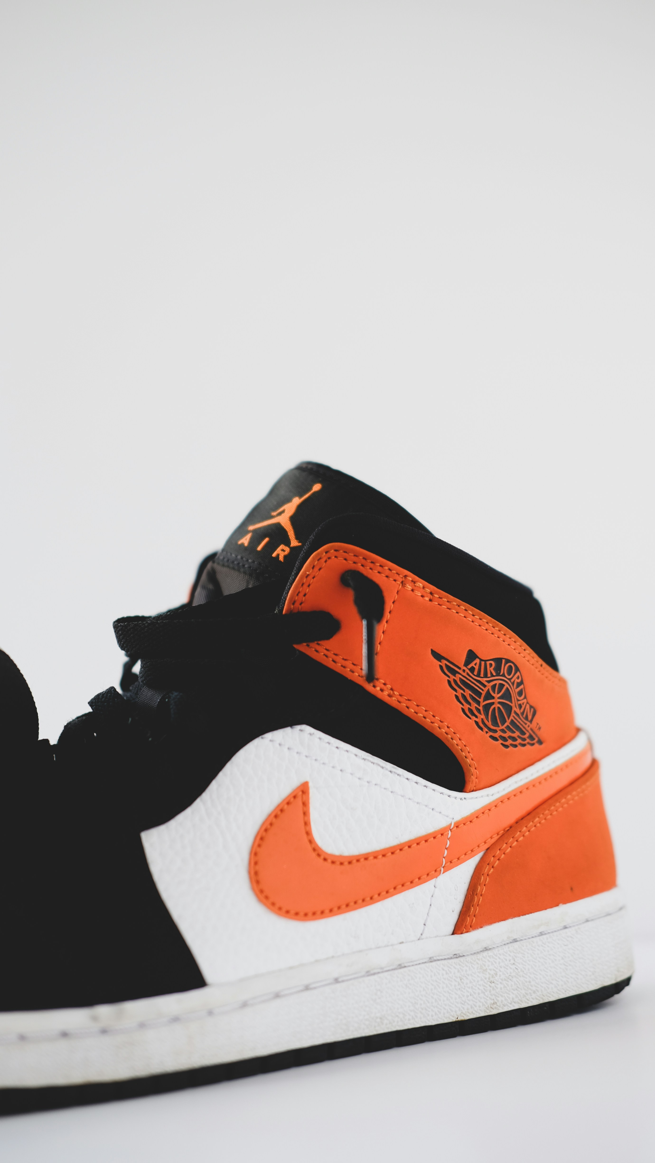 black white and orange nike shoes