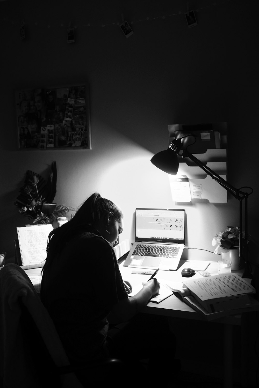 woman in black shirt sitting in front of computer