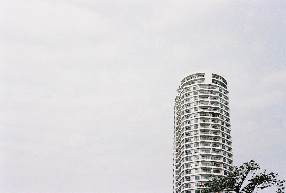 white concrete building under white sky during daytime