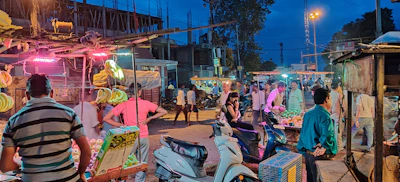 An evening market bustling with vendors and locals exchanging fresh produce and handmade goods