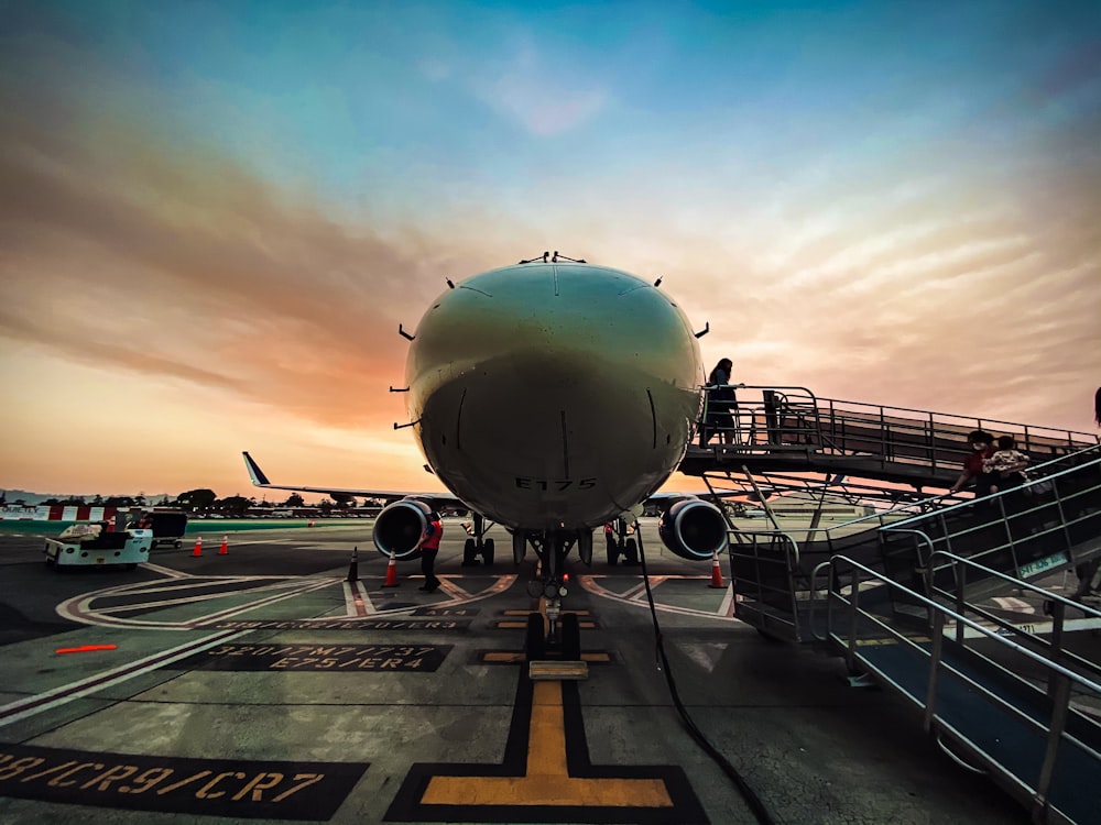 white airplane on airport during daytime