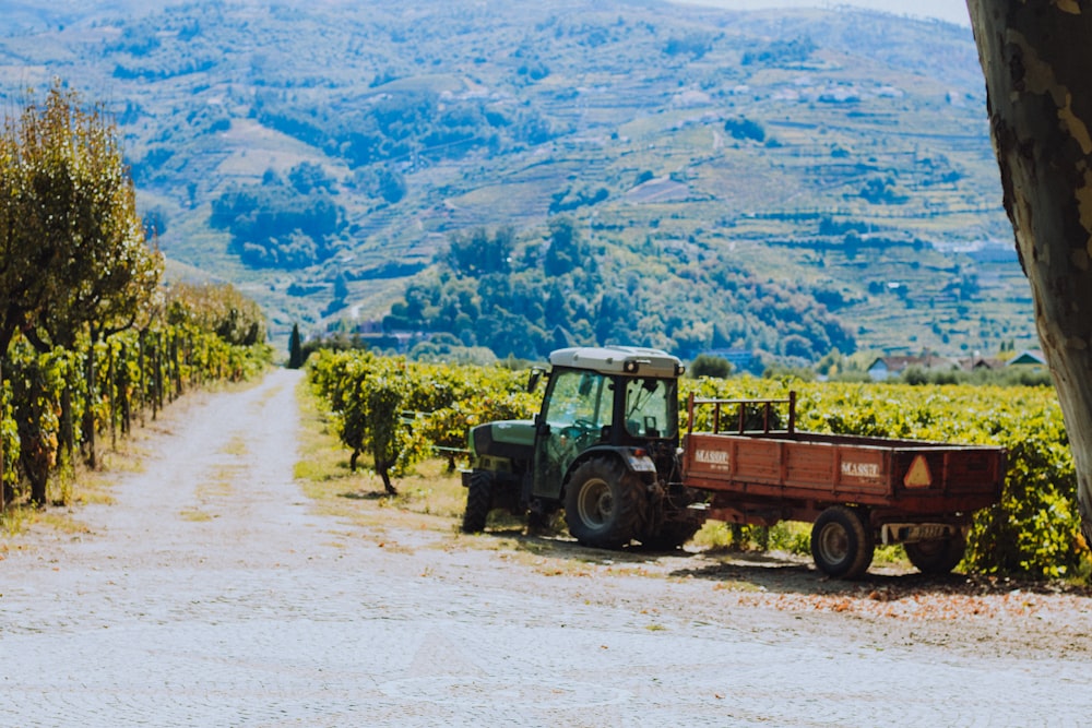 red and black utility truck on dirt road during daytime