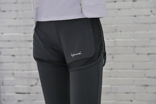 A sleek navy blue zip-up jacket over matching leggings, perfect for cool weather training sessions.