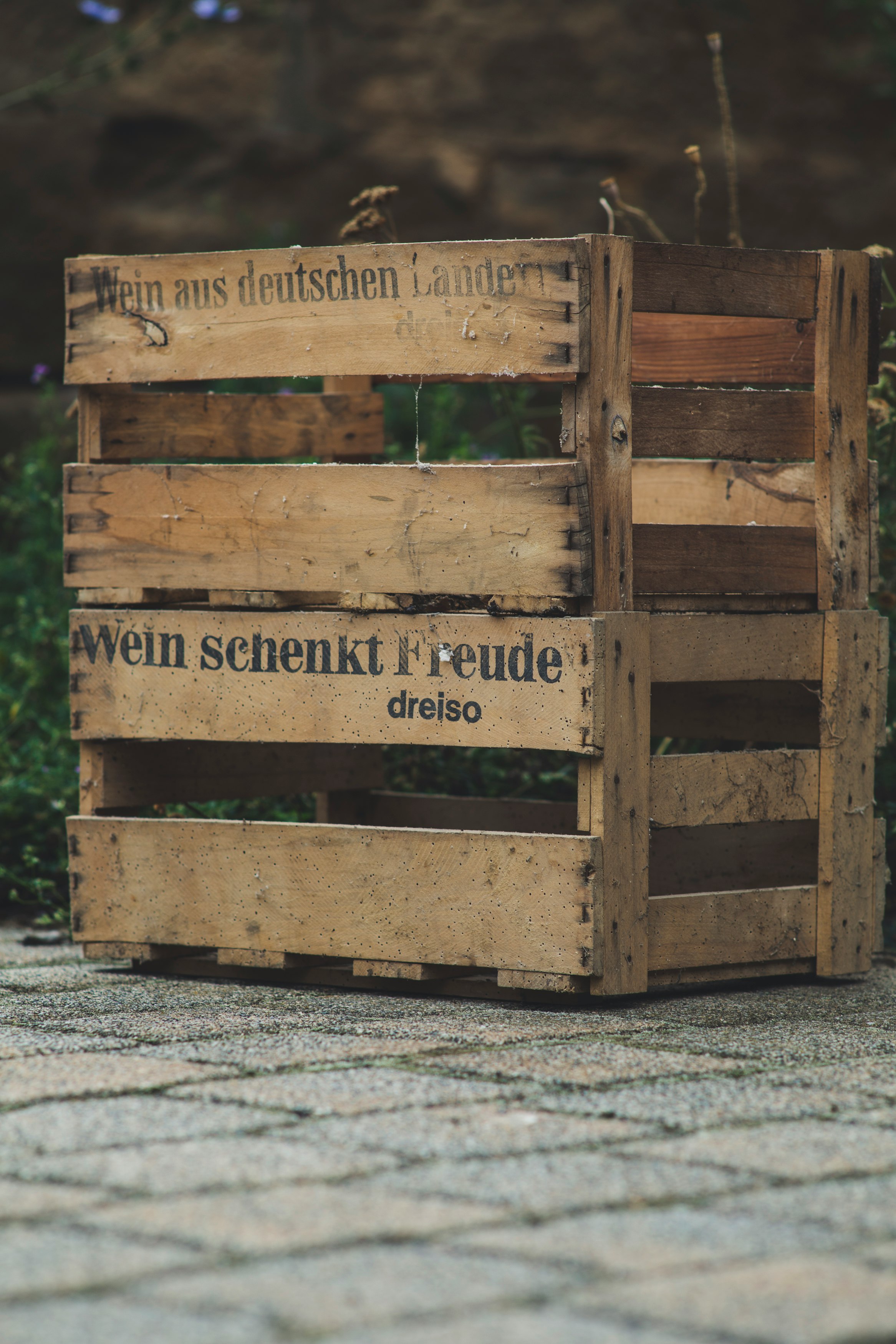 brown wooden crate on gray concrete floor