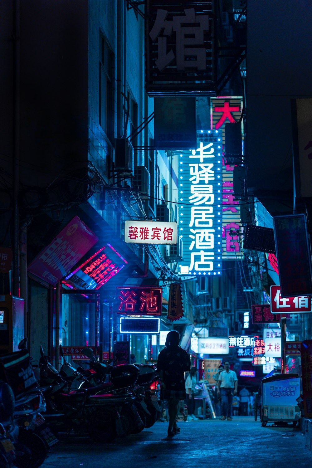 people walking on street during nighttime