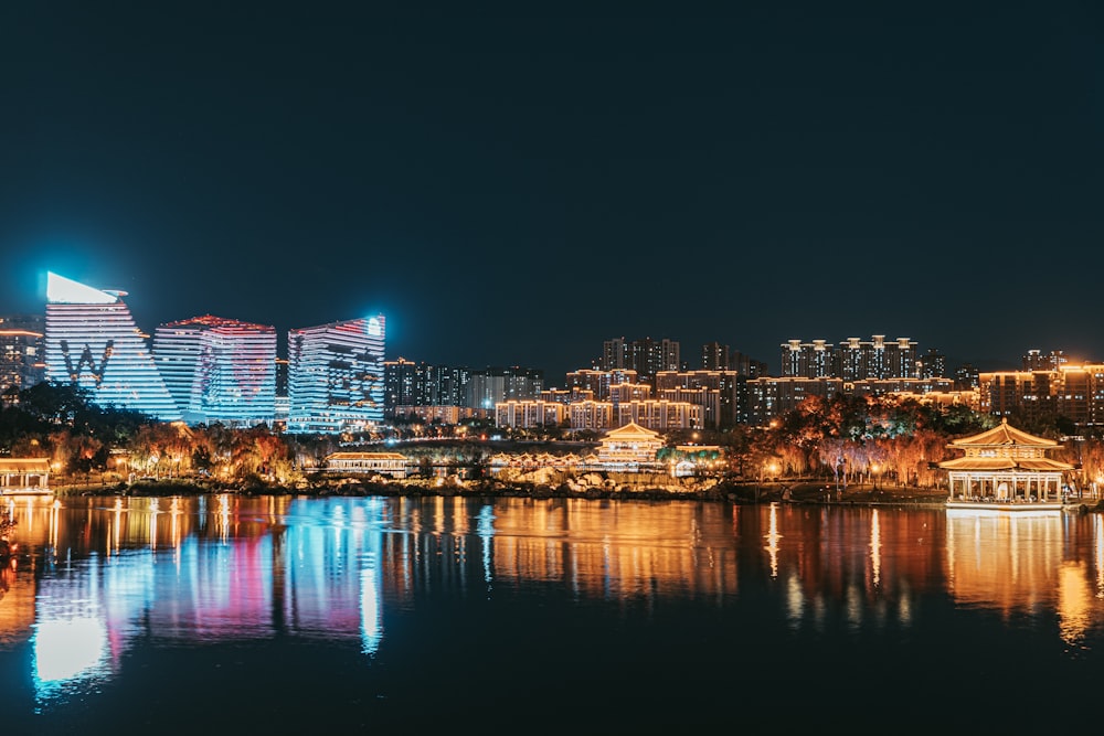 a large body of water with a city in the background