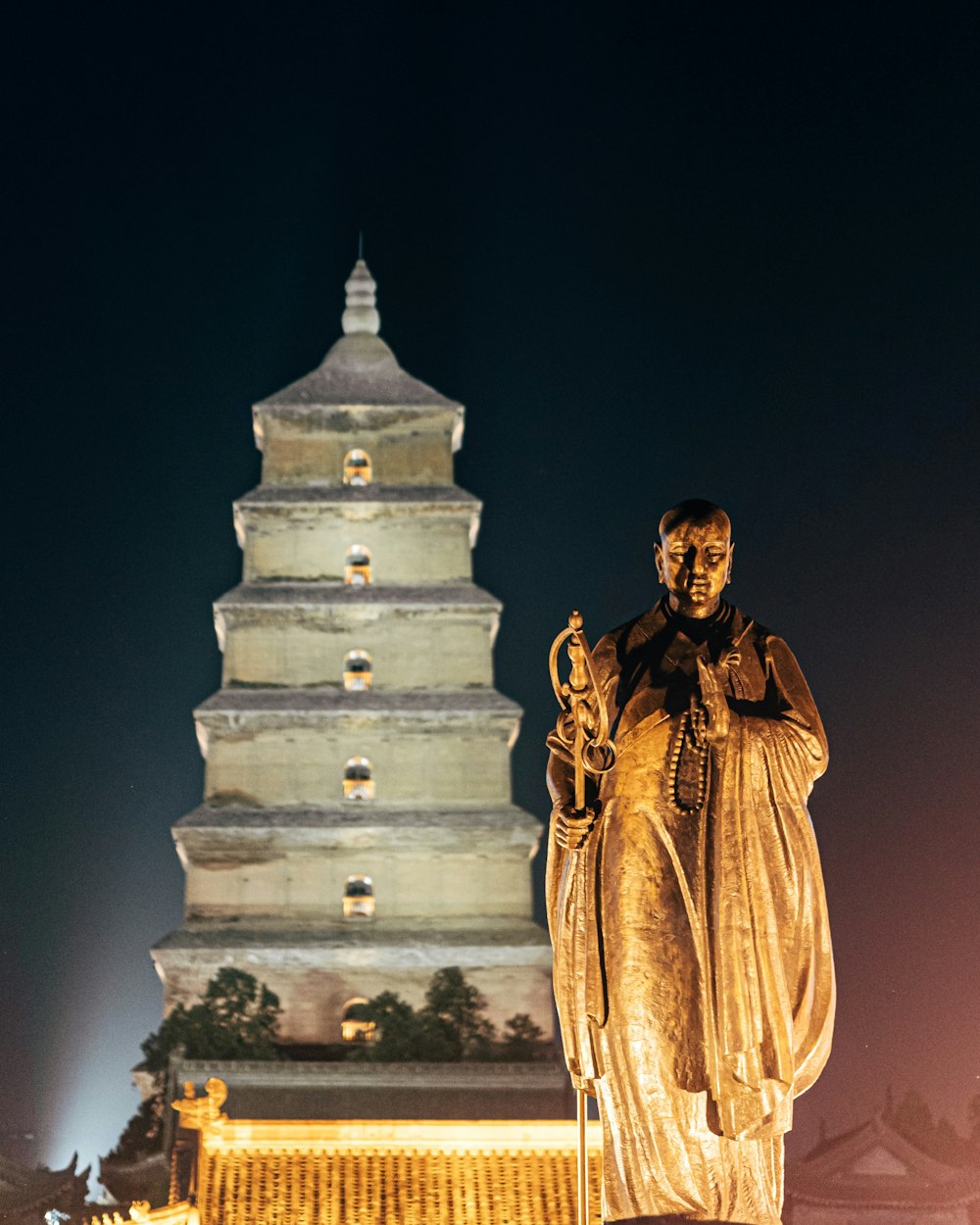 gold statue of man in gold robe