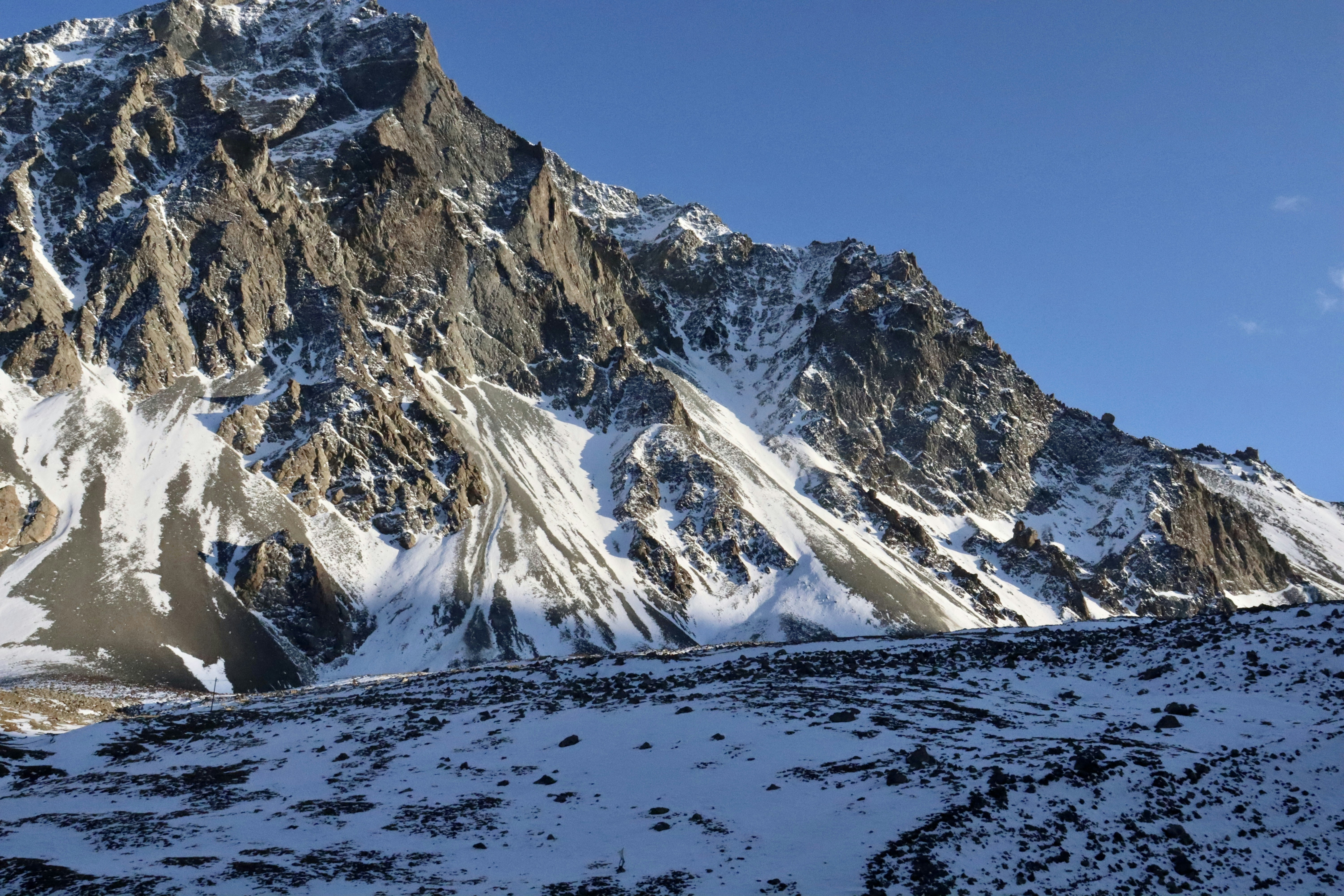snow covered mountain under blue sky during daytime