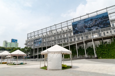 white canopy tent near building during daytime