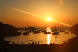 silhouette of people on boat during sunset