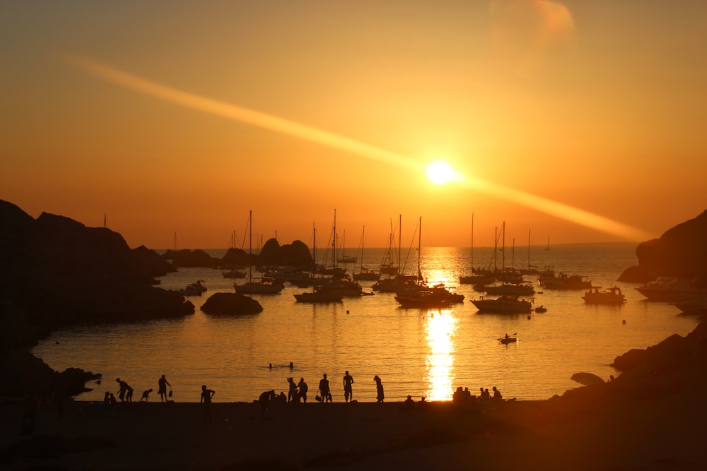 silhouette of people on boat during sunset