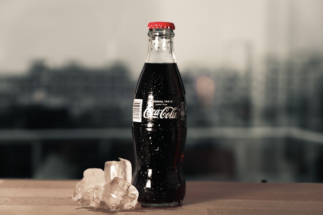 coca cola zero bottle on brown wooden table
