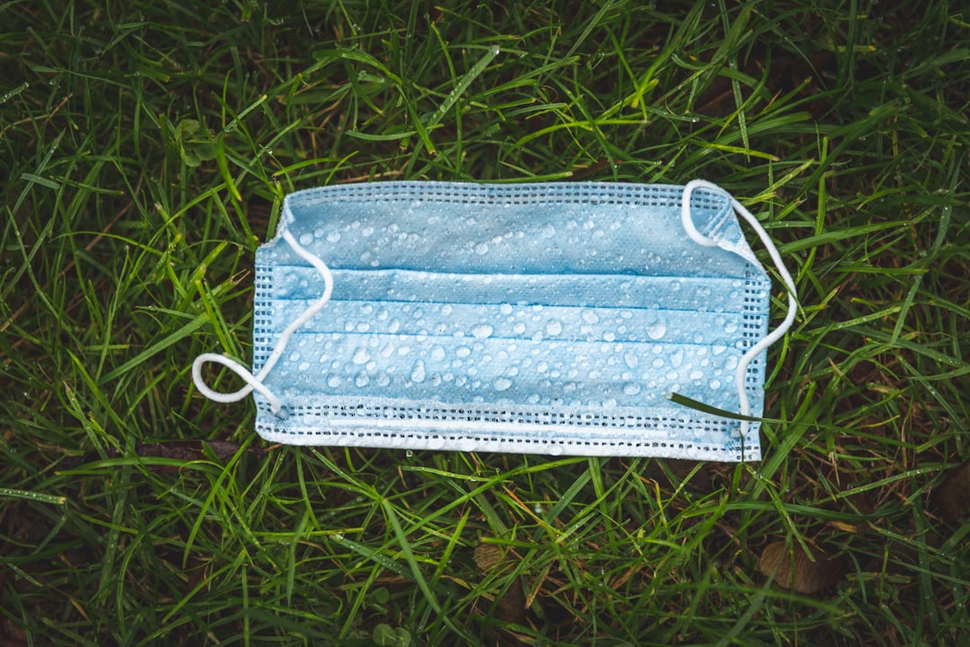 white leather pouch on green grass