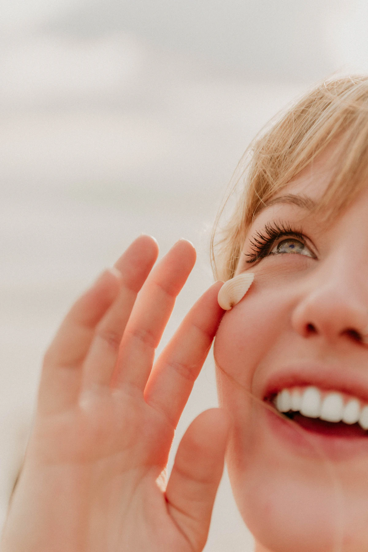 Smiling woman with calm, healthy-looking skin