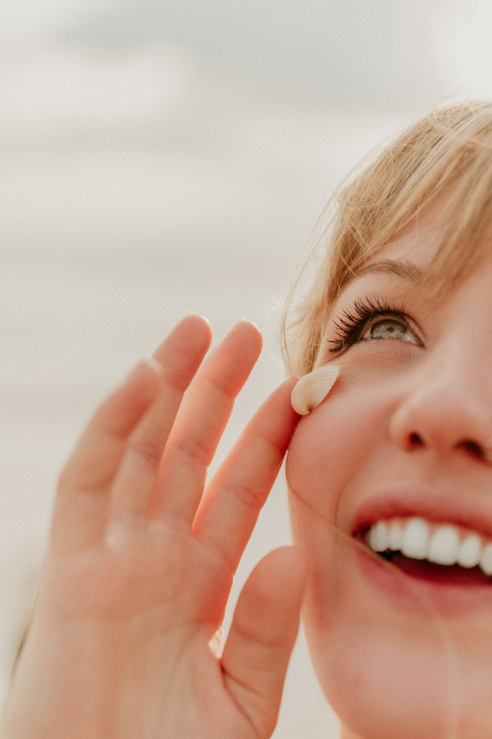 girl with blonde hair smiling