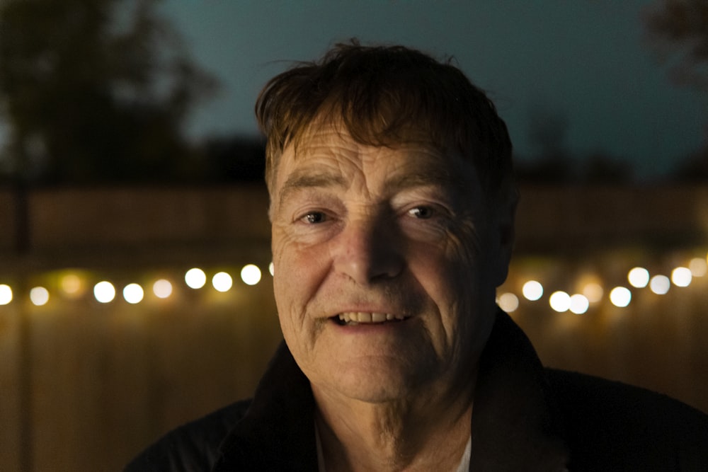 man in black collared shirt