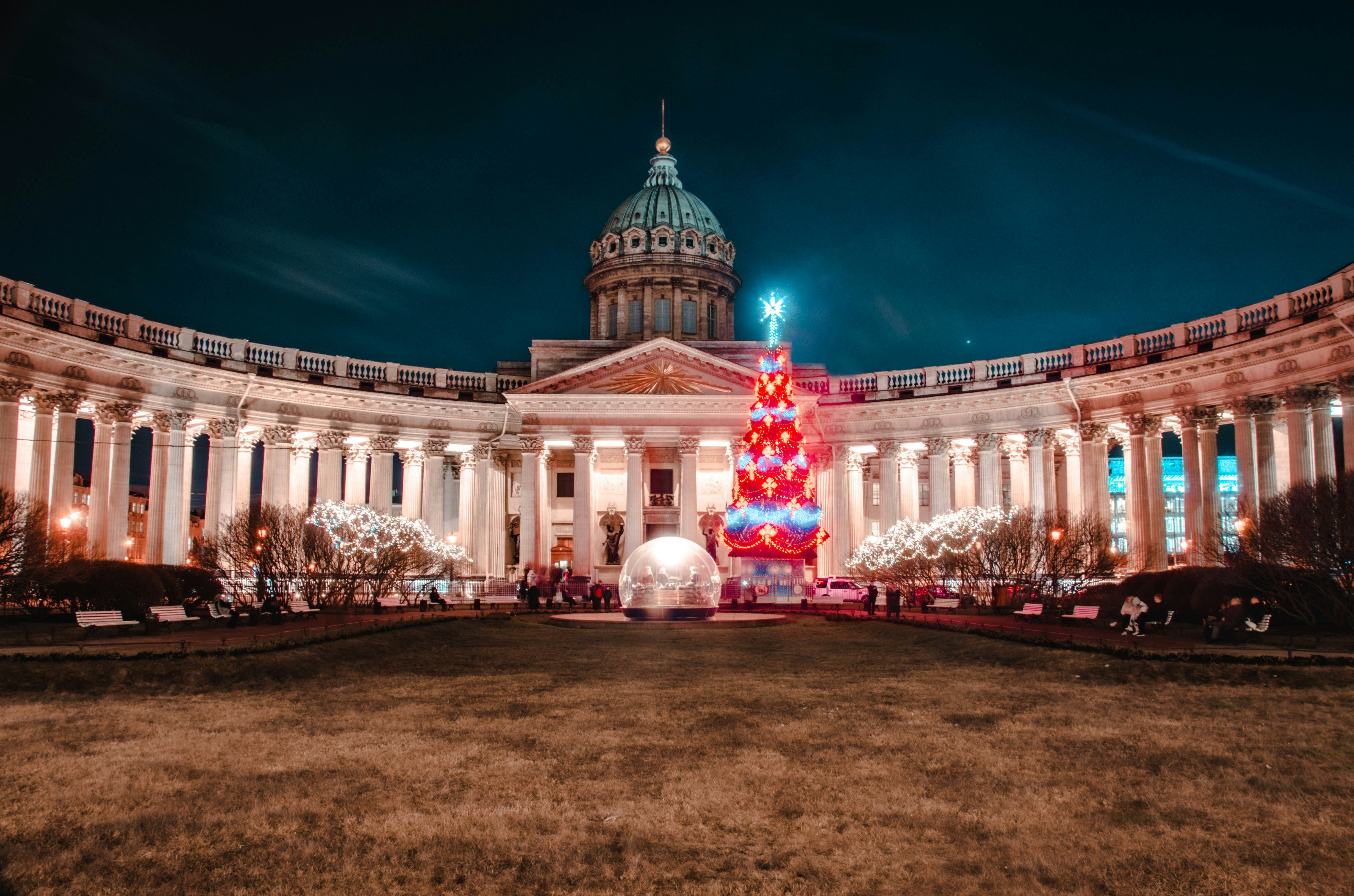white concrete building with red lights during night time