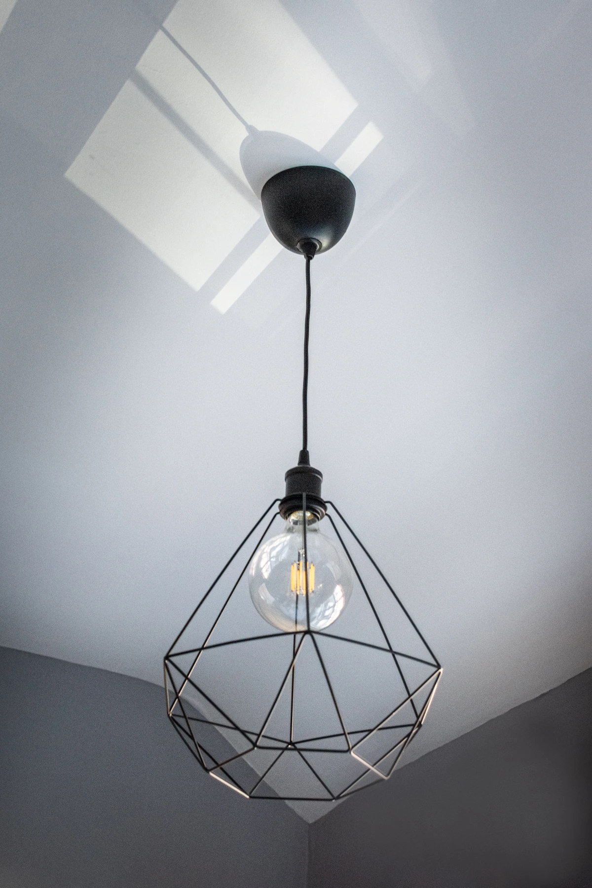 Modern pendant lighting upgrade installed in an apartment