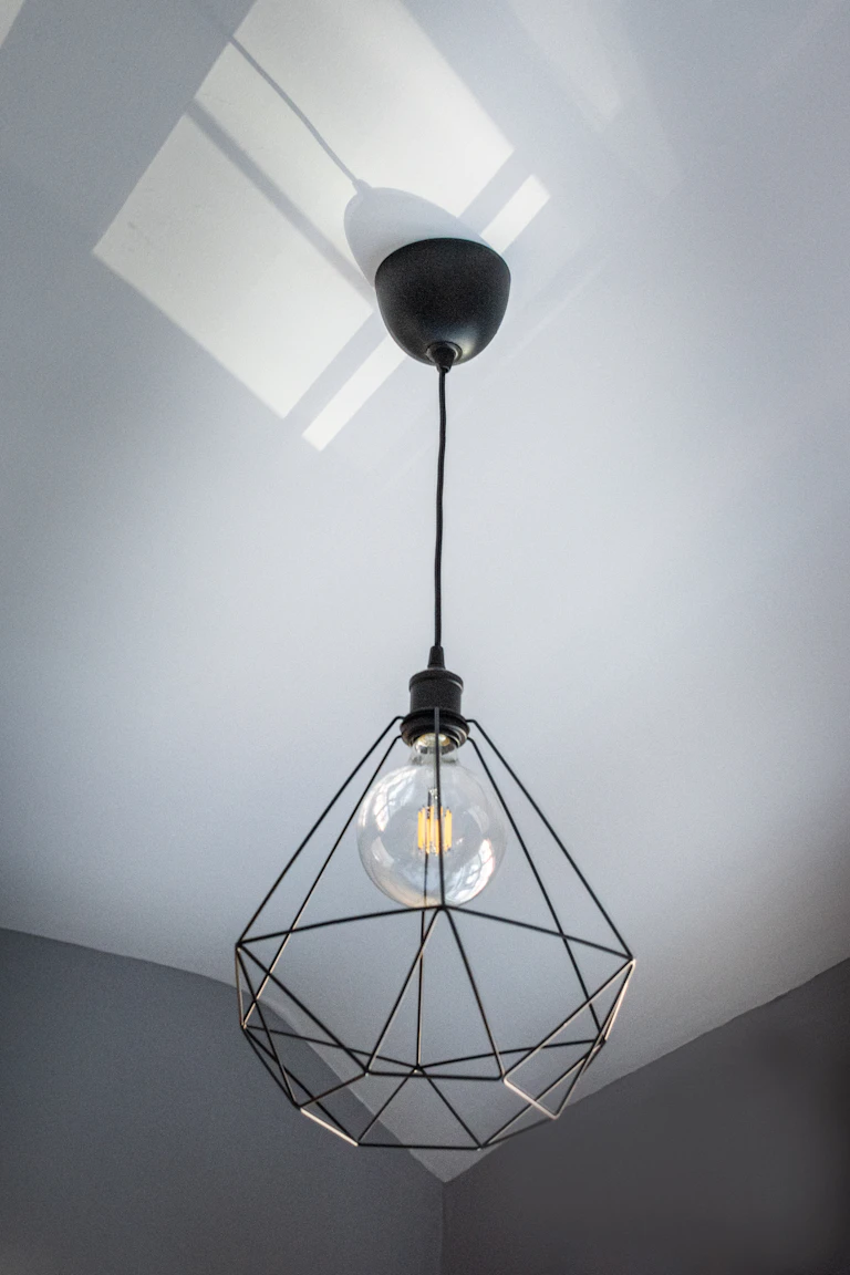 Modern geometric pendant light fixture installed in a home