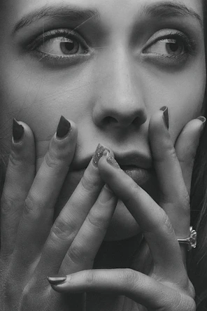 grayscale photo of womans face