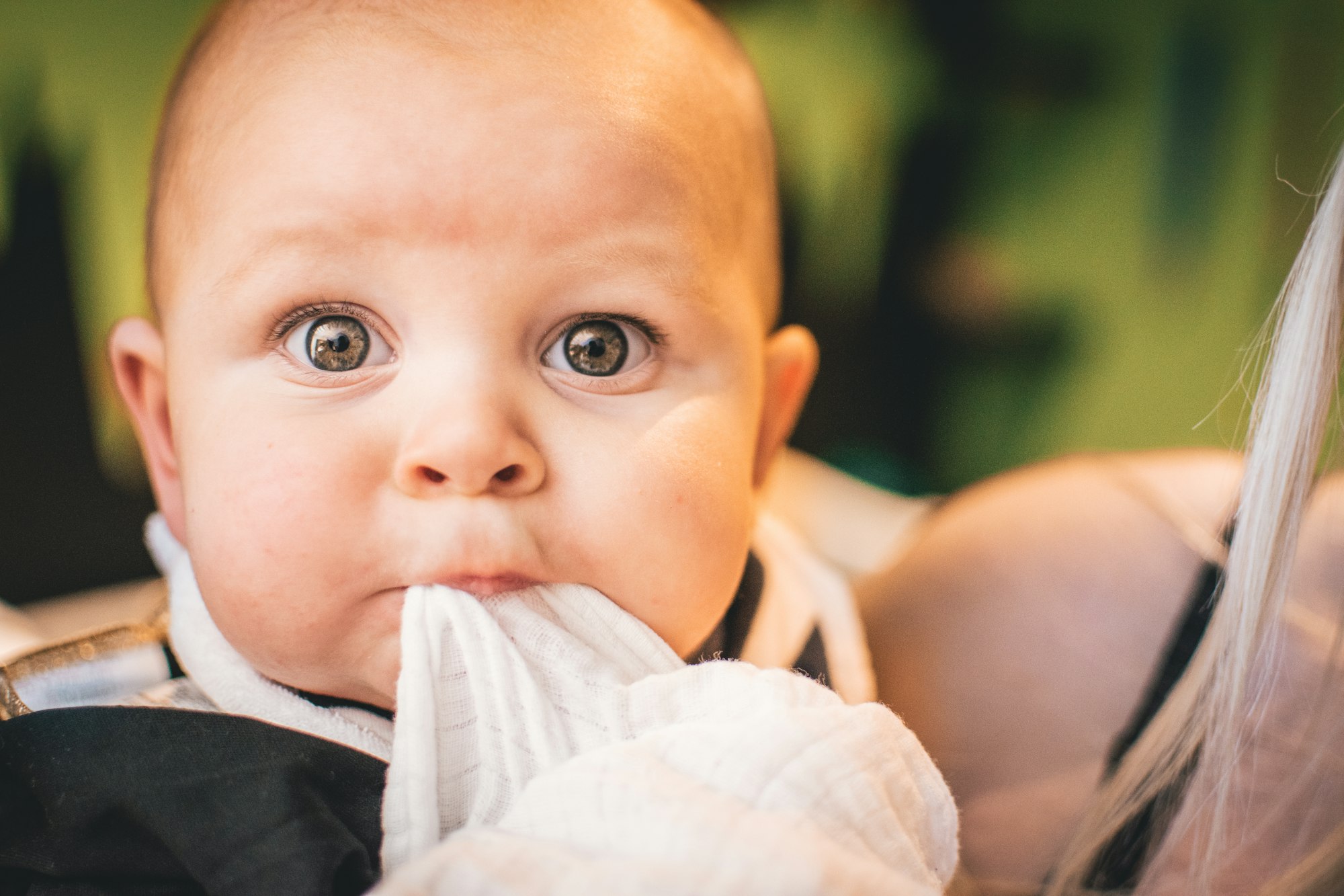 Baby biting, beautiful baby, big eyes baby