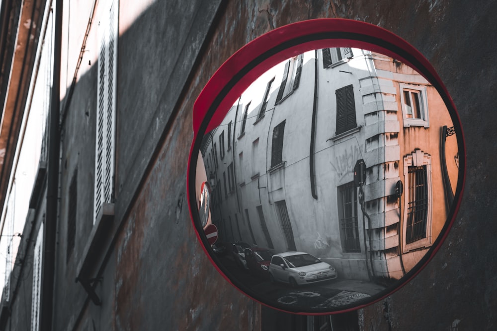 red round mirror on brown wooden wall