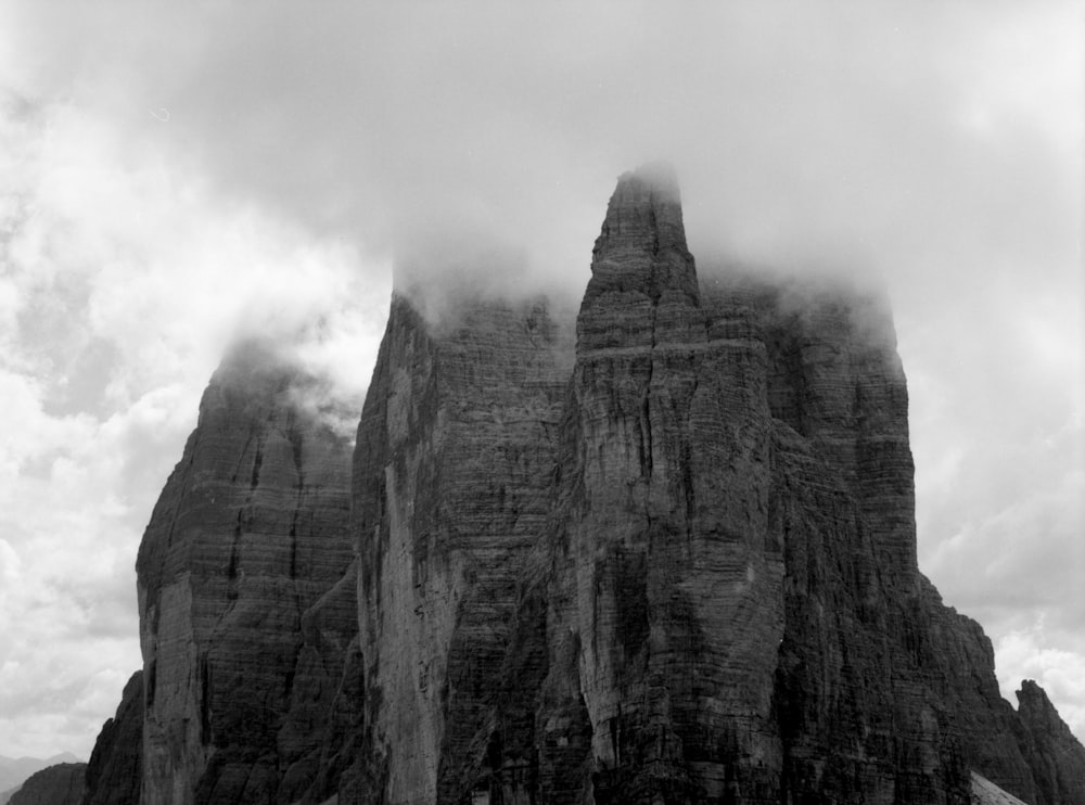 gray rocky mountain under white clouds