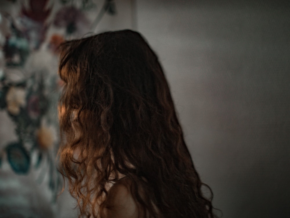 woman with brown hair looking at the camera